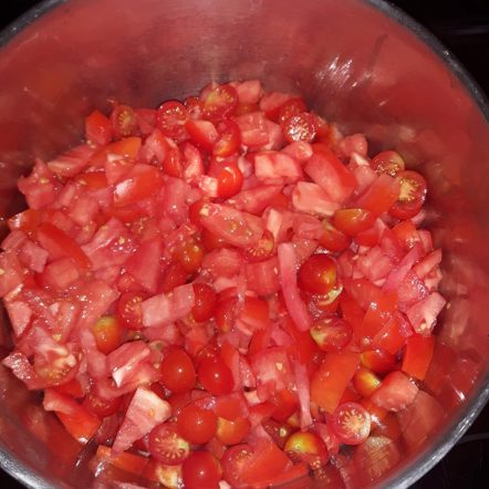 preserving tomatoes cooking on stove