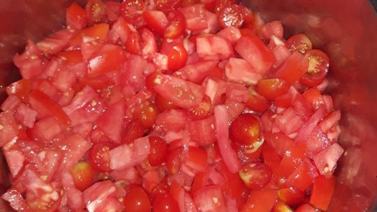 preserving tomatoes cooking on stove