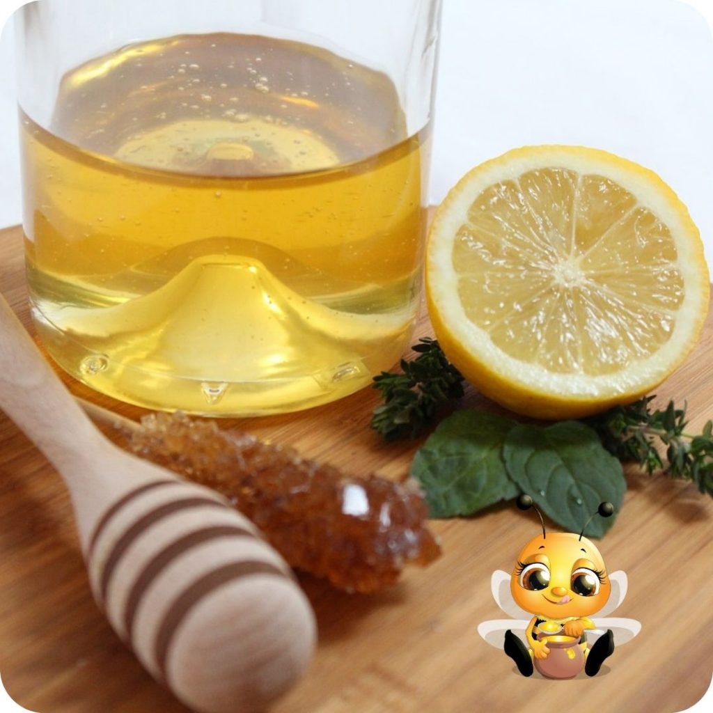 Lemon, busy bee and honey on cutting board